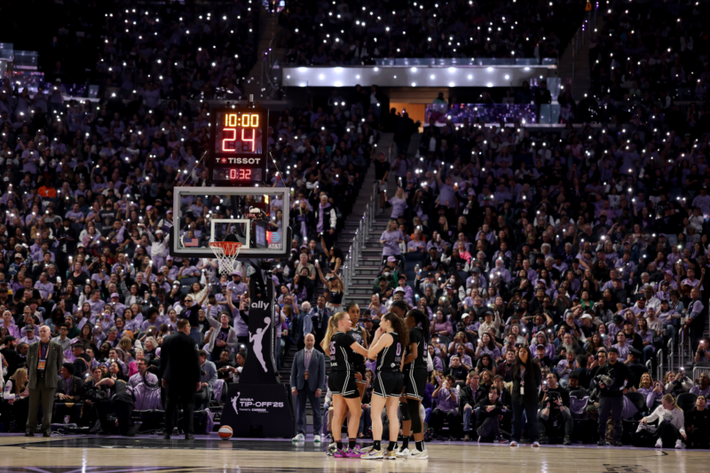A basketball game at Cakebread Cellars arena with players and spectators during a match.